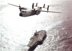 Navy C-2A Greyhound over Aircraft Carrier 
